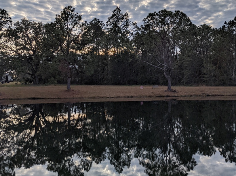 The reflection of trees and clouds on the lake at PRVP