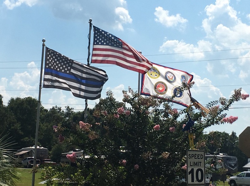 American Flag, Thin Blue Line and US Military flags flying